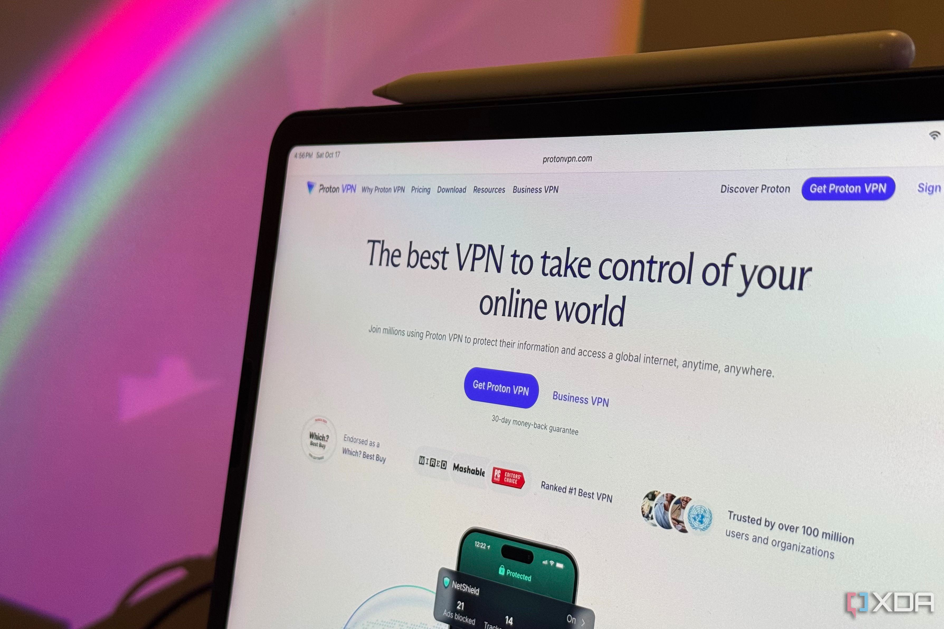 iPad showing the Proton VPN homepage with its Get Proton VPN button and press badges