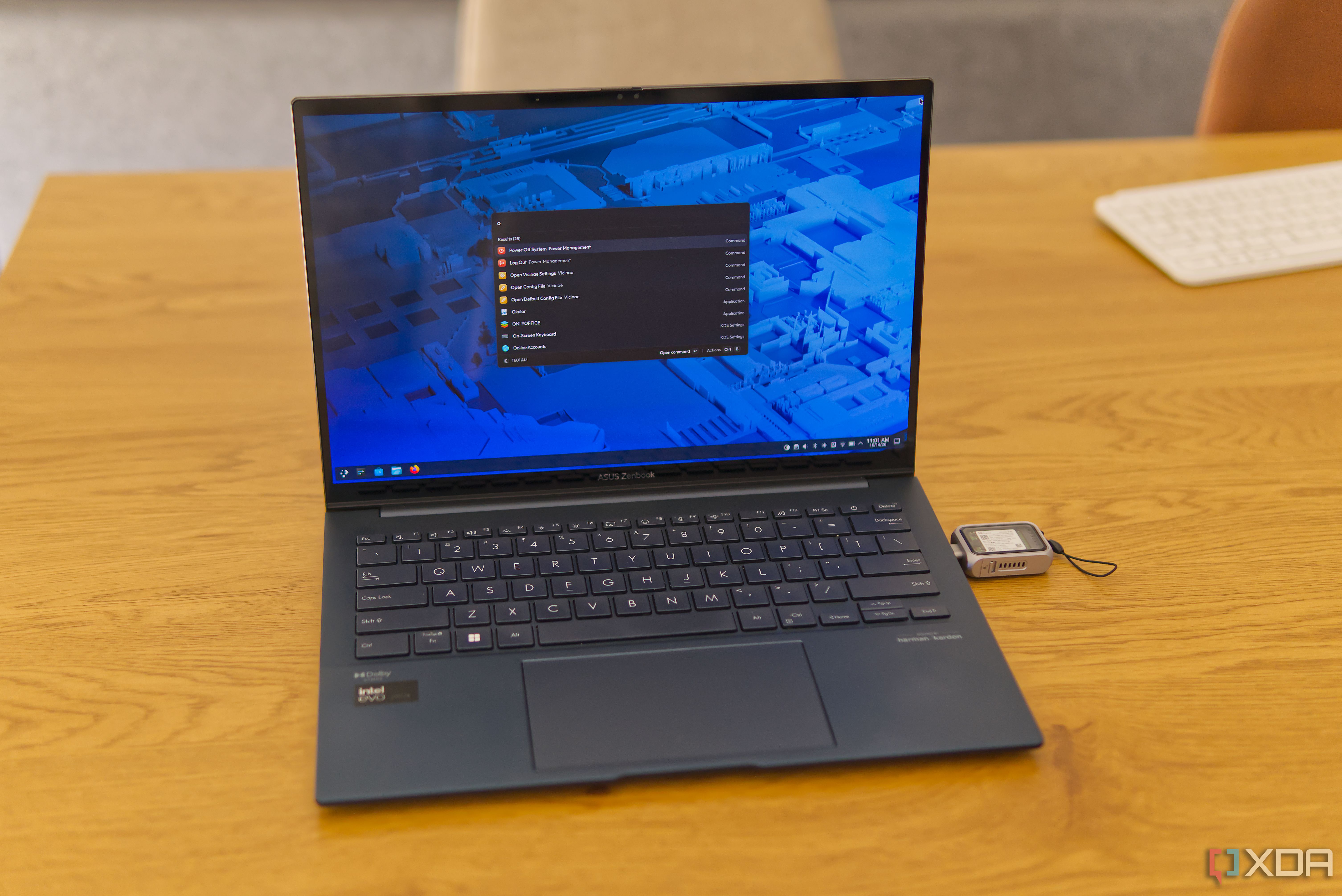 A dark blue laptop running Fedora KDE Plasma off of a USB drive