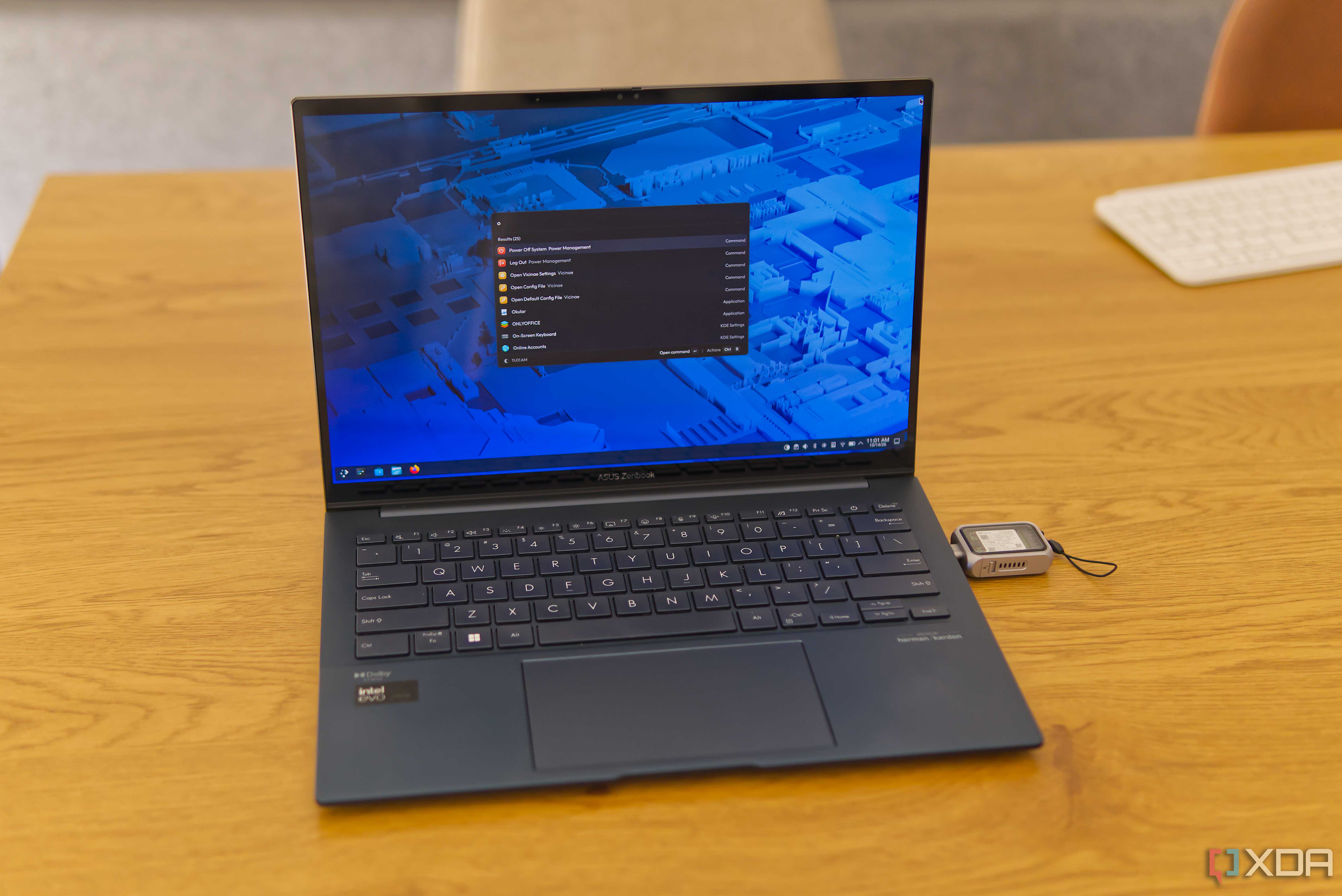 A dark blue laptop running Fedora KDE Plasma off of a USB drive