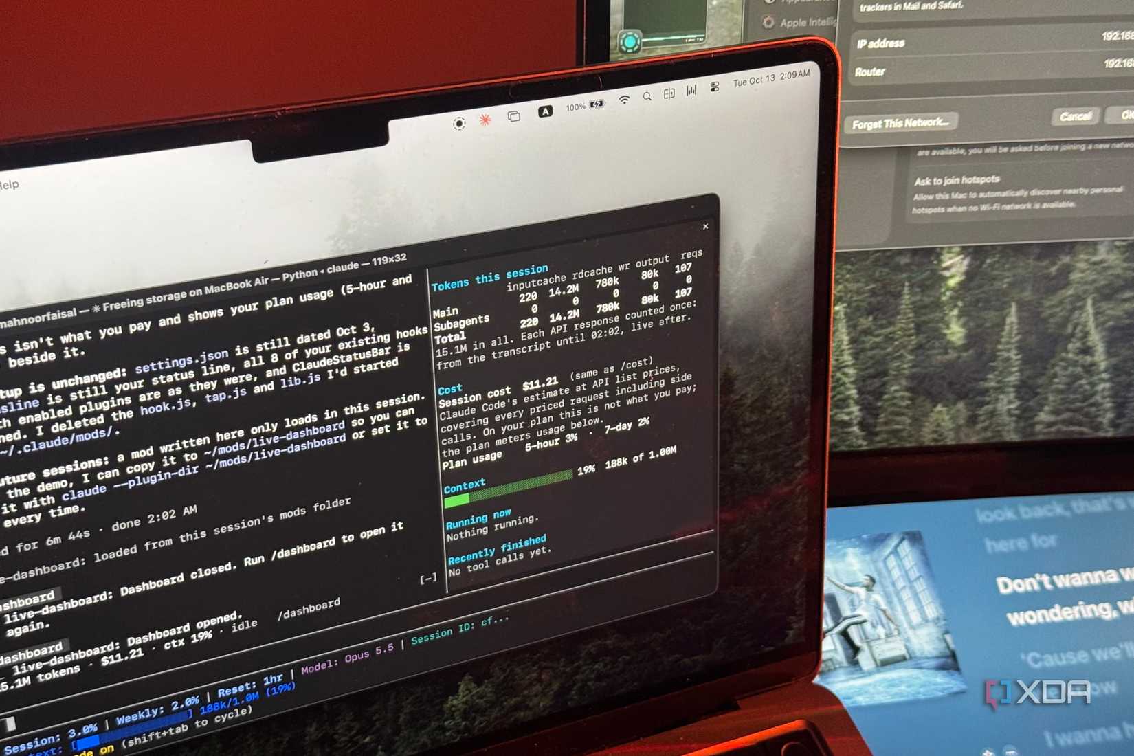 MacBook Air showing Claude Code with a live usage dashboard of tokens, cost and context