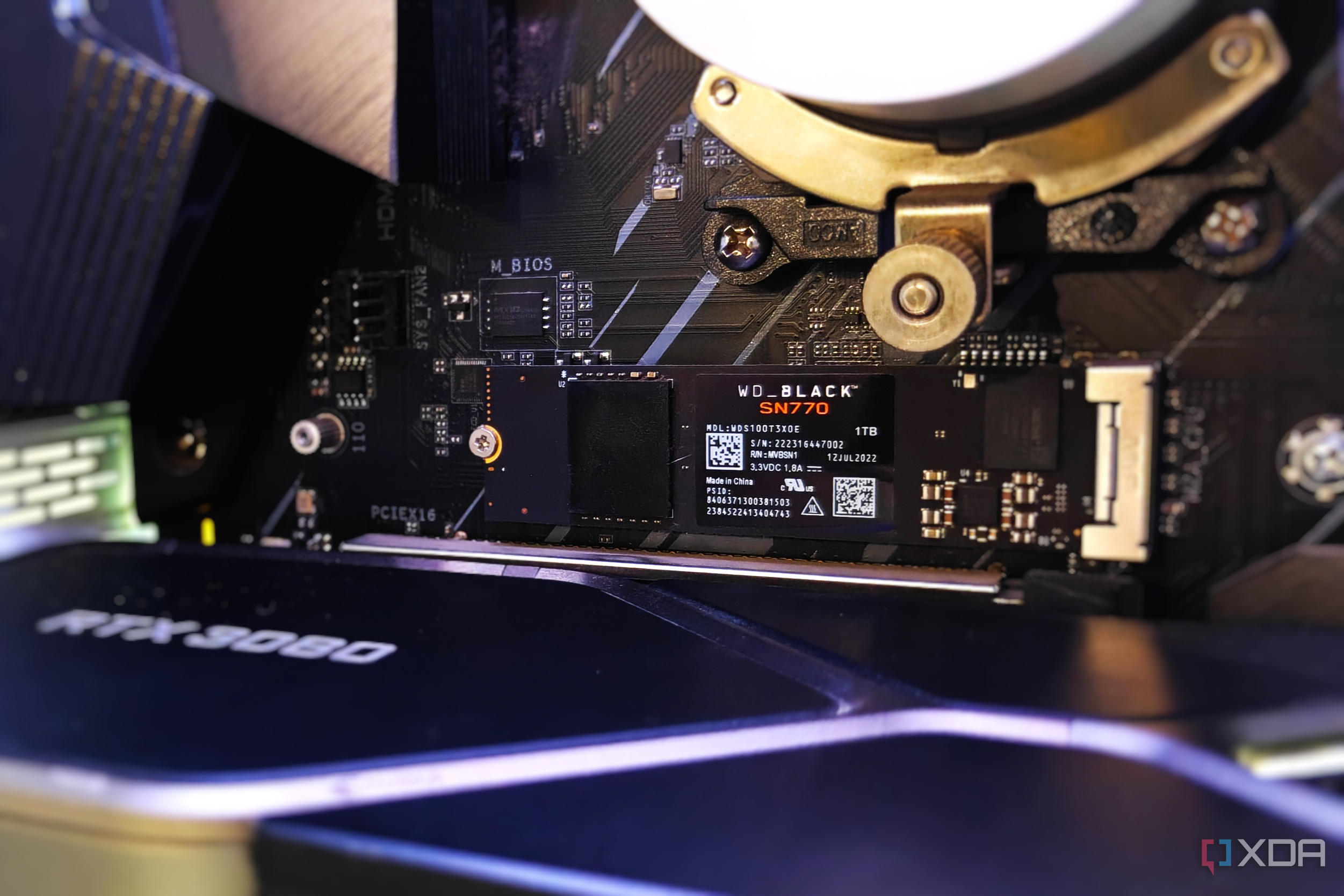 Close-up of an NVMe SSD installed on a motherboard inside a gaming pc
