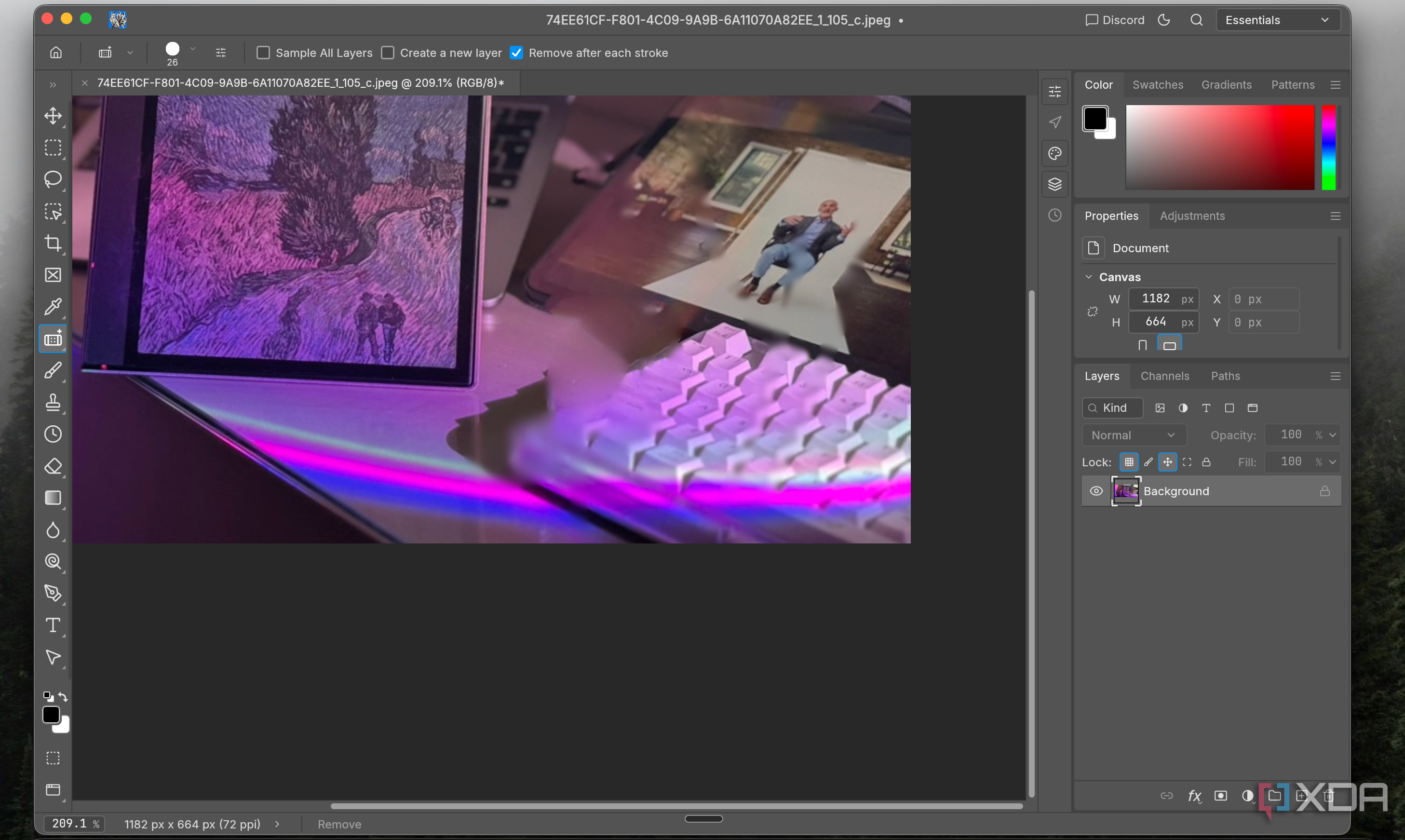 PhotoCraft Remove tool erasing part of a keyboard in the zoomed-in desk photo