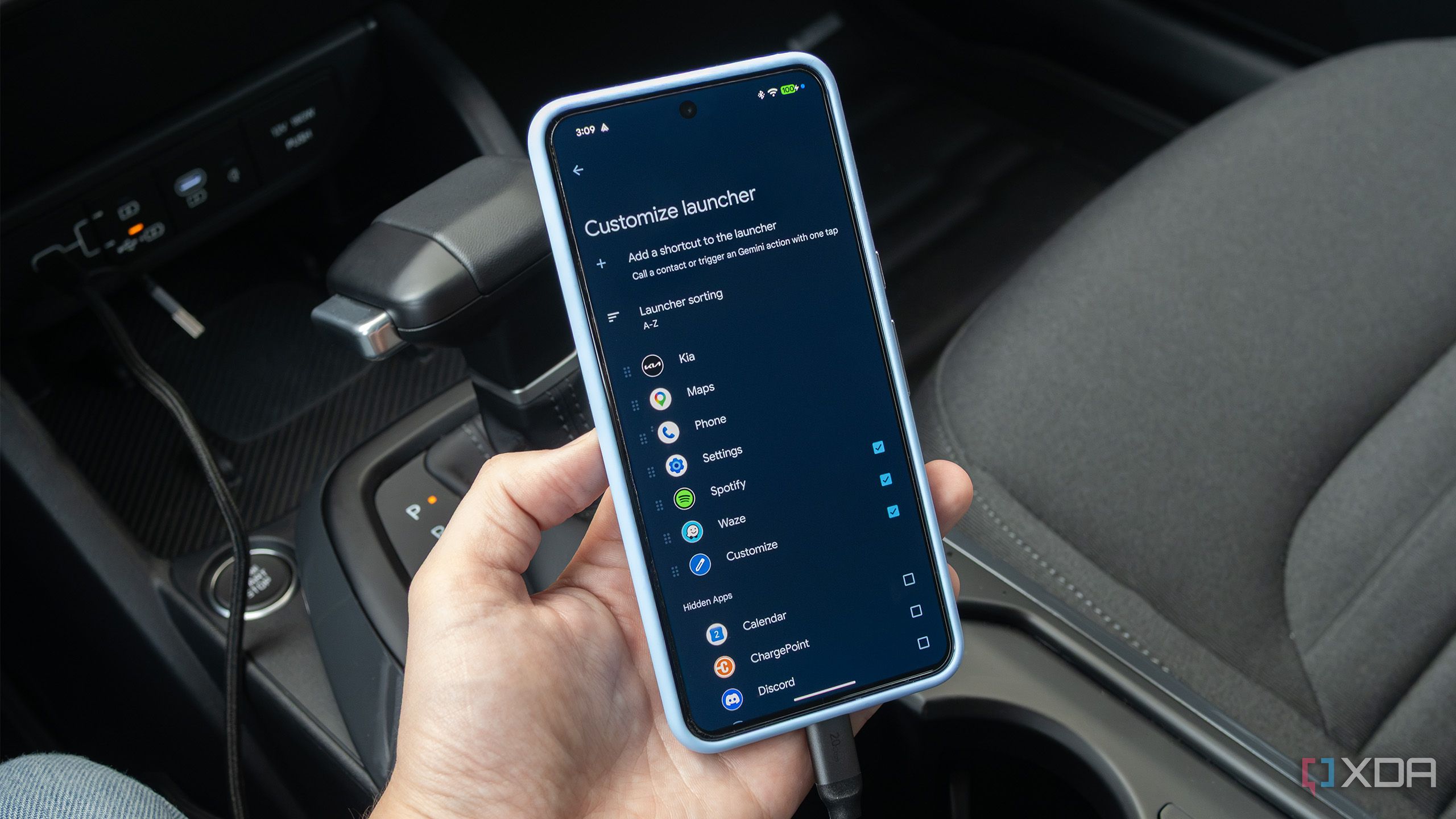 The Pixel 8 Pro with Android Auto's launcher customization open 