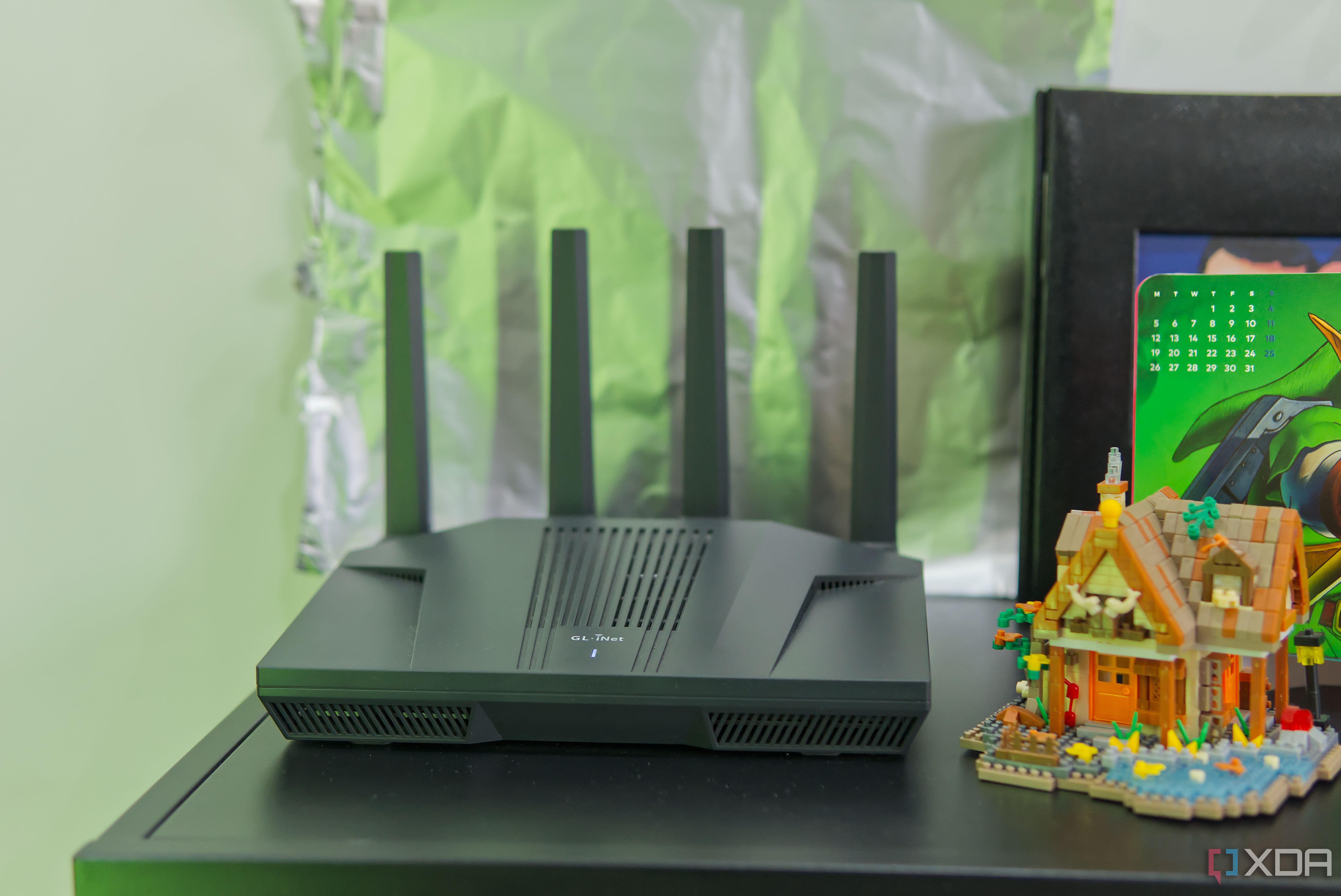 A Wi-Fi router with an aluminum foil sheet behind it