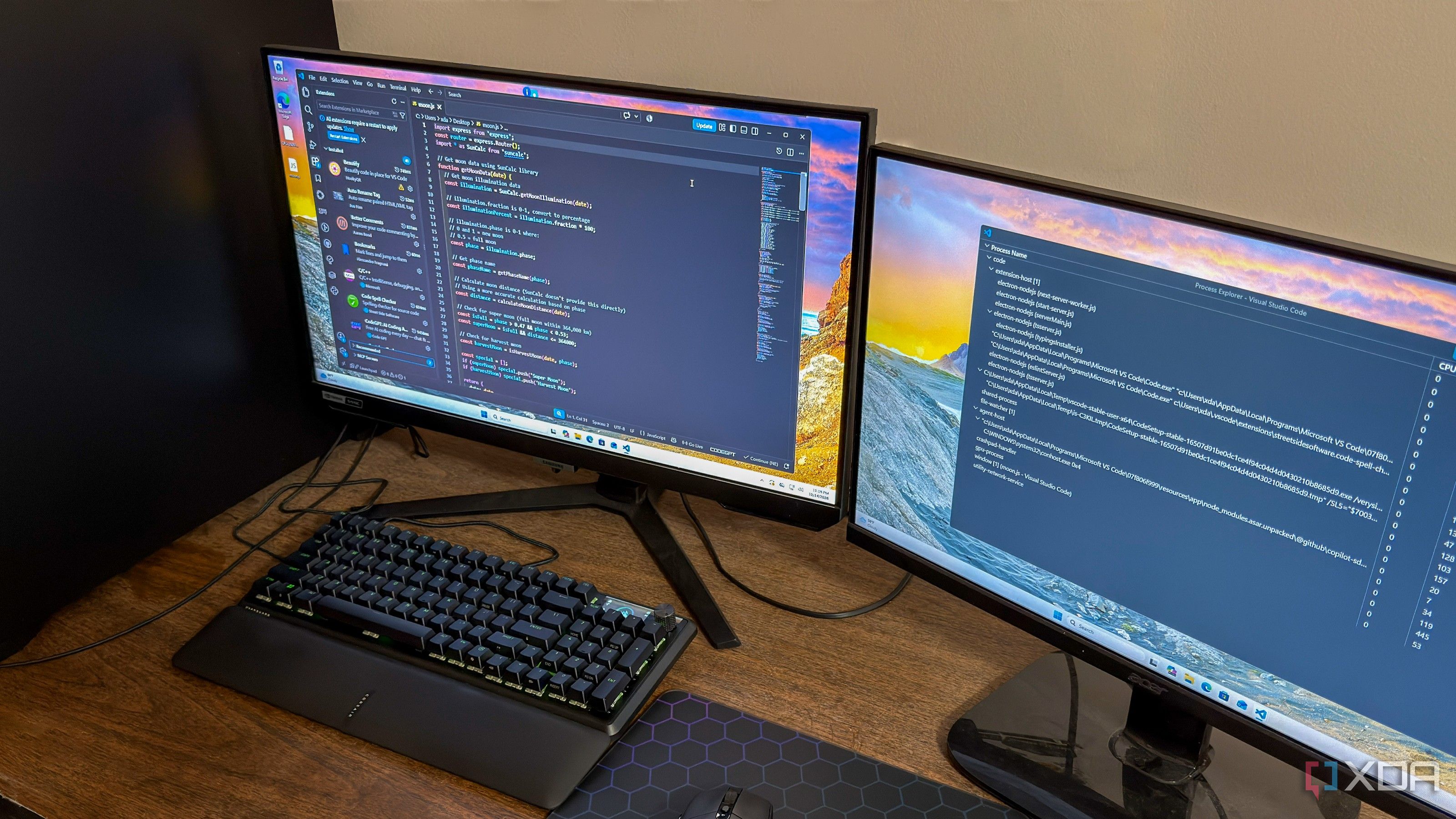 Two monitors side-by-side, one showing the main VS Code window and the other showing process Explorer