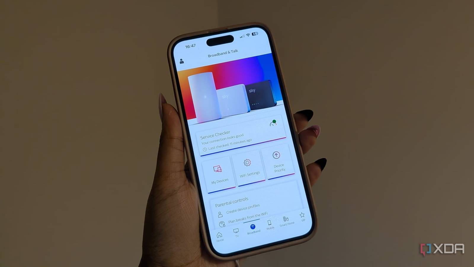 sky internet settings on a phone being held up