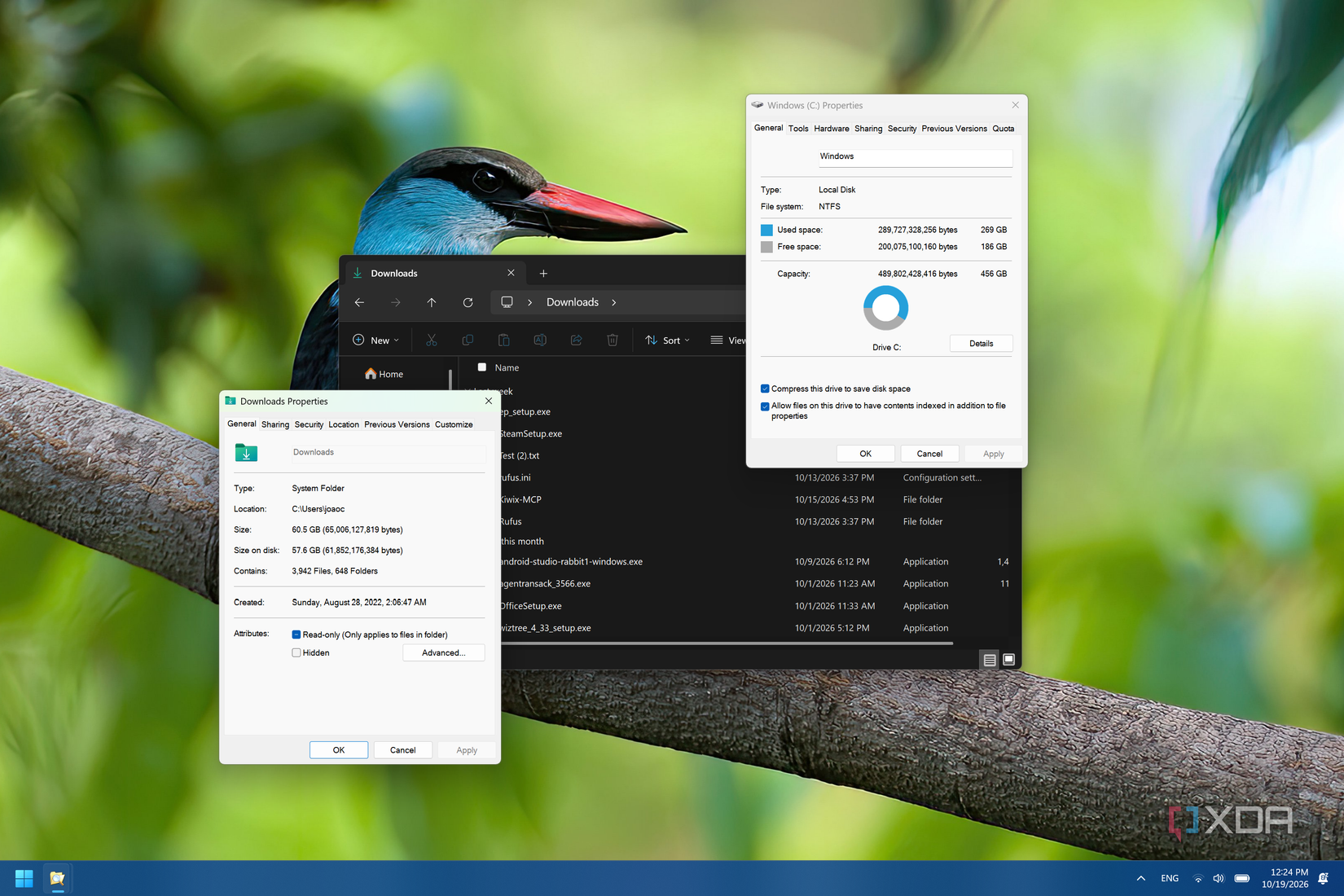 Screenshot of Windows 11 showing the size of all files on a drive after compressin, along with a dialog showing the size of a specific folder next to its compressed size