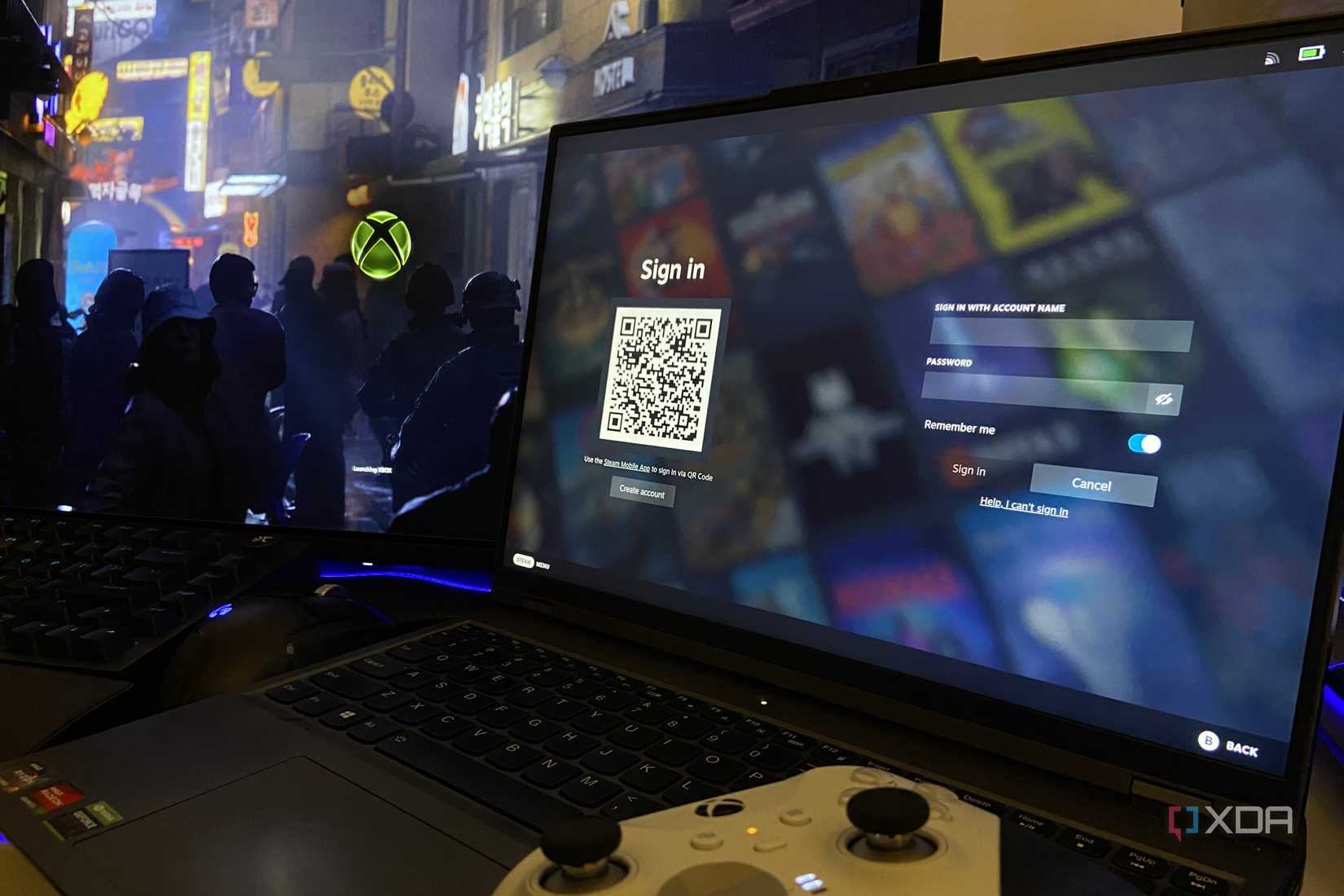 A PC running desktop mode and a laptop running Steam via Bazzite.