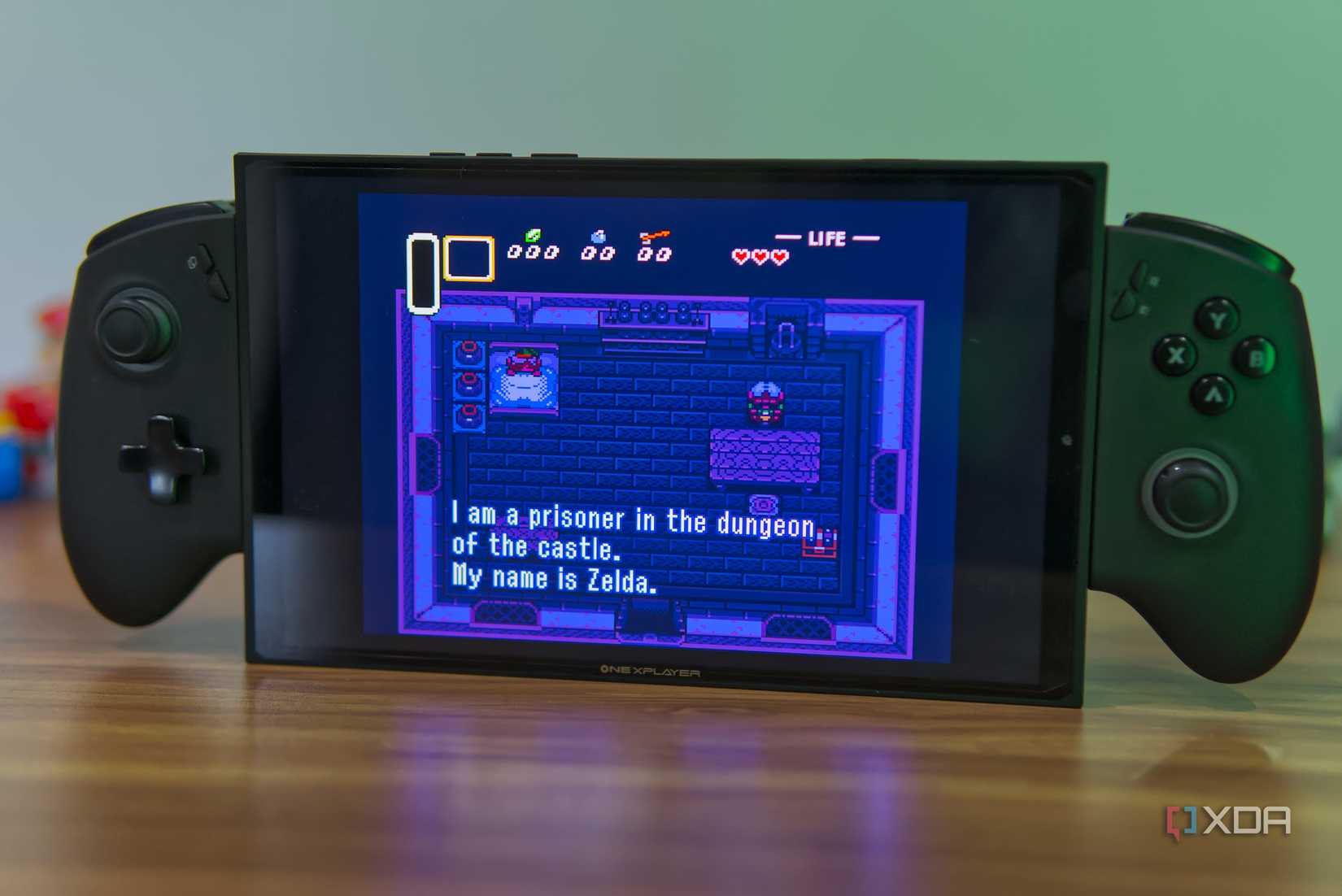 A gaming handheld running The Legend of Zelda A Link to the Past in an emulator playing the initial introduction sequence